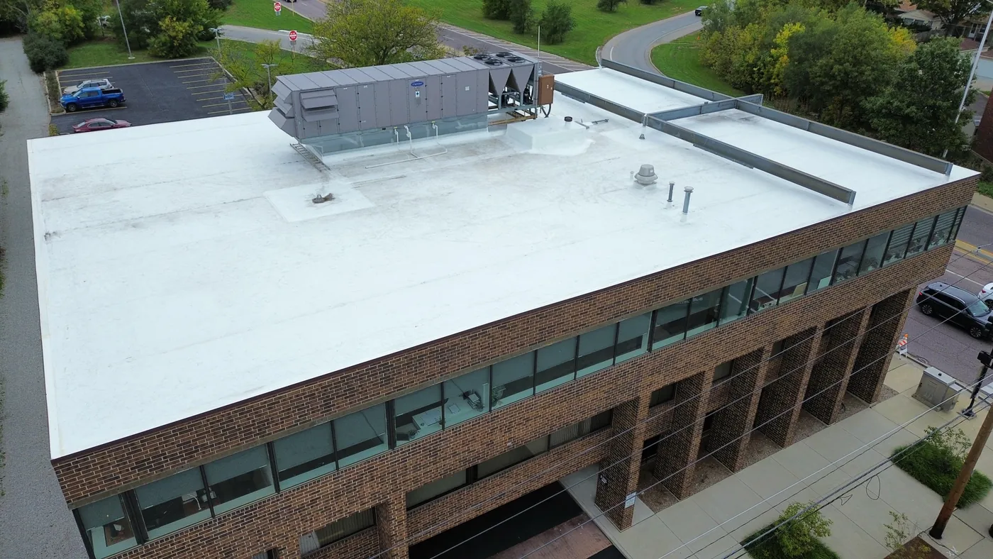 After: Completed white TPO roof on commercial office building