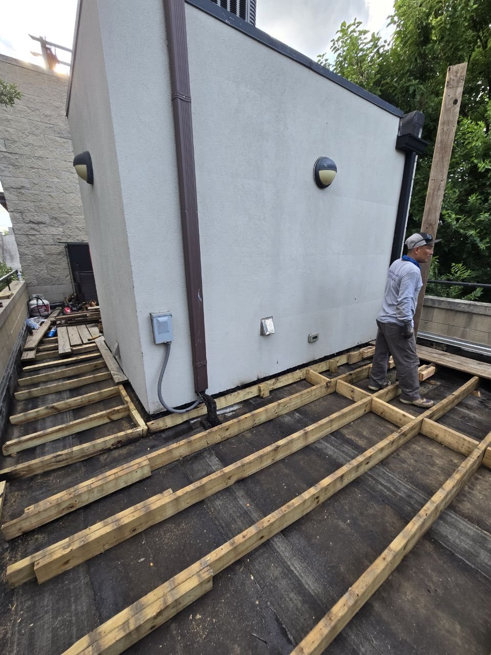 Before: Deck joists and framing during construction