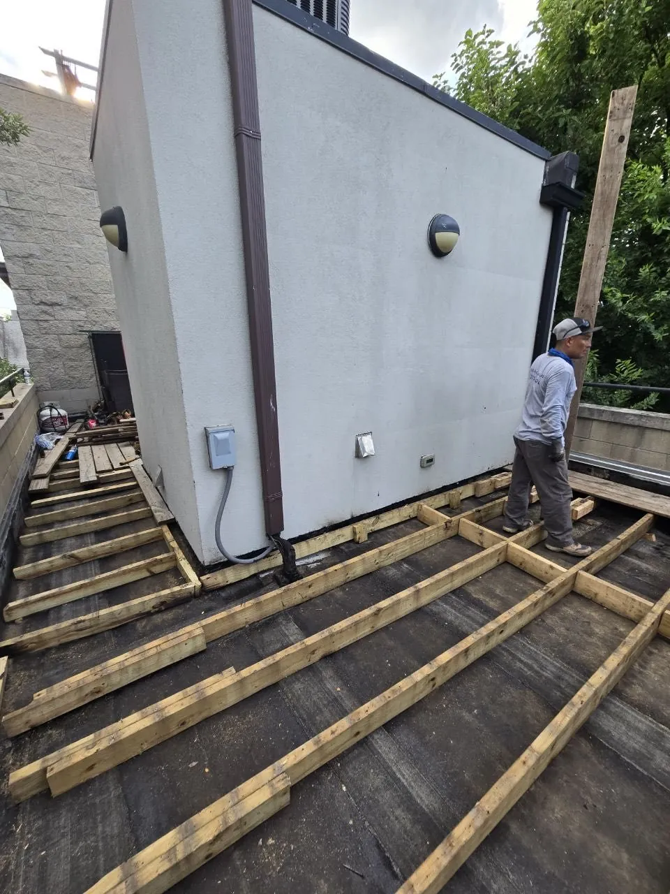 Before: Deck joists and framing during construction