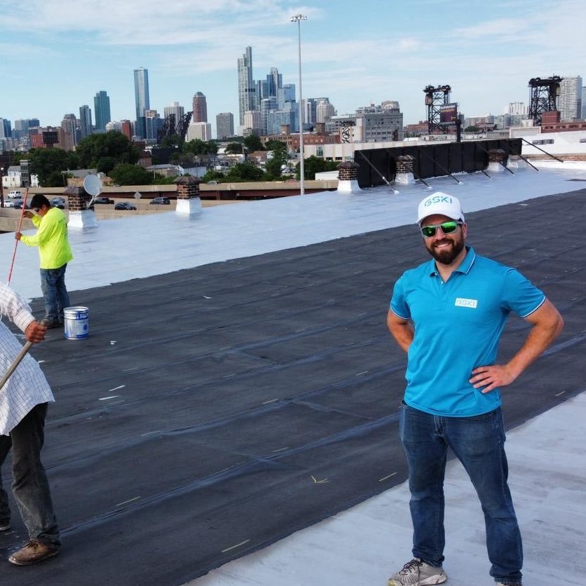 Mike Garbowski - President of GSKI Construction Group on a commercial rooftop with Chicago skyline